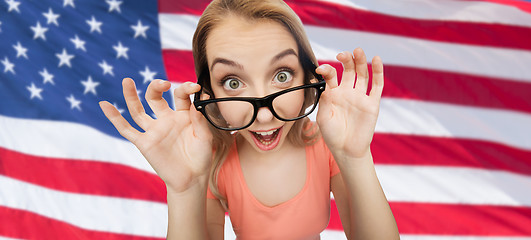 Image showing happy young woman or teenage girl in eyeglasses