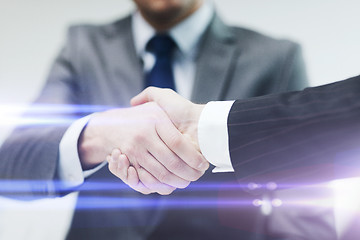 Image showing two businessmen shaking hands in office