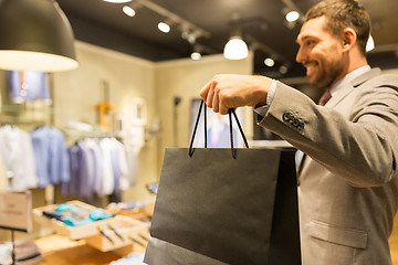 Image showing close up of man with shopping bags at store