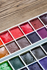 Image showing watercolor paint-box. selective focus