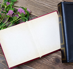 Image showing Flat lay with photo album and flowers
