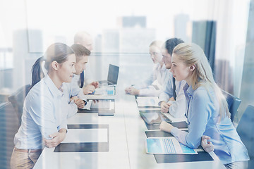 Image showing smiling business people having conflict in office