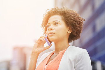 Image showing african businesswoman calling on smartphone