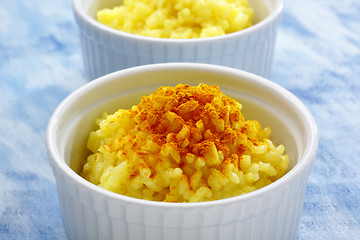 Image showing Rice (boiled with curcuma) and curcuma powder topping