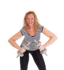 Image showing Middle age woman workout with dumbbells.