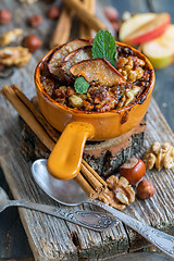 Image showing Oatmeal with apple, spices and honey. View from above.