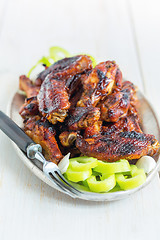 Image showing Chicken wings on a plate with green pepper.