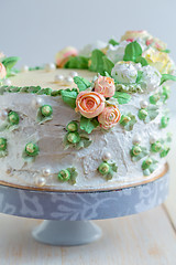 Image showing Cake with cream roses and sugar pearls.