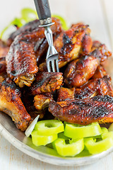 Image showing Delicious chicken wings in a sweet glaze.