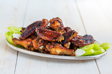 Image showing Baked chicken wings with honey and ginger.
