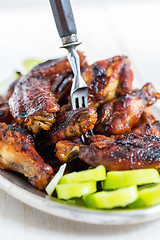 Image showing Chicken wings with honey-ginger sauce.