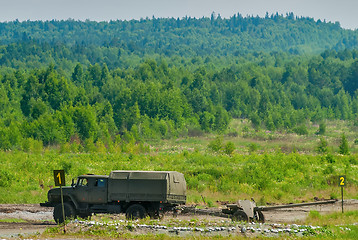 Image showing army truck transports a gun