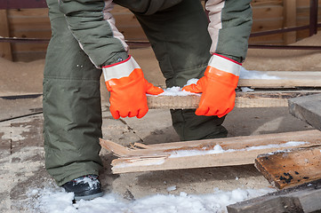 Image showing Carpenter working at sawmill 