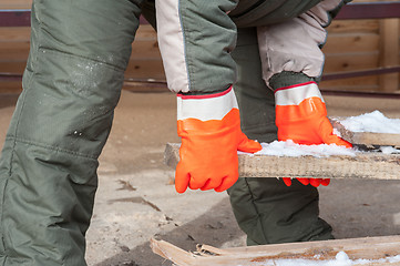 Image showing Carpenter working at sawmill 