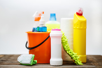 Image showing Bucket with cleaning items on light background