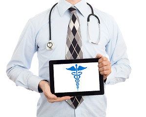 Image showing Doctor holding tablet - Caduceus symbol