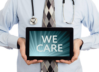 Image showing Doctor holding tablet - We care