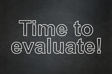 Image showing Time concept: Time to Evaluate! on chalkboard background