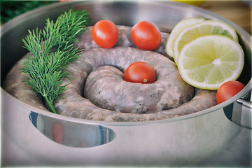 Image showing Homemade pork sausage in a frying pan for a roast.