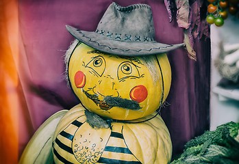 Image showing Funny statue made from two pumpkins in the form of a man in a ha
