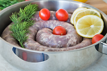 Image showing Homemade pork sausage in a frying pan for a roast.