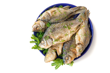 Image showing Roasted carp on a plate on a white background.