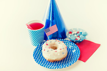 Image showing donut with juice and candies on independence day