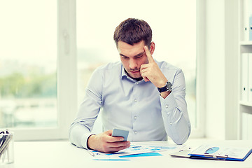 Image showing close up of businessman with smartphone