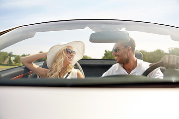 Image showing happy man and woman driving in cabriolet car