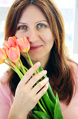 Image showing Mature woman with flowers