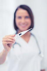 Image showing doctor with thermometer and stethoscope