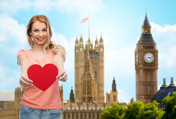 Image showing happy woman or teen girl with red heart shape