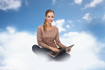 Image showing young woman sitting with laptop