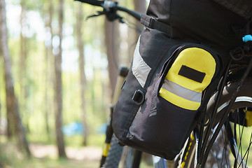 Image showing Bicycle tourist with loaded bike