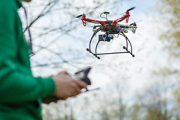 Image showing Man controling a drone.