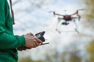 Image showing Man controling a drone.