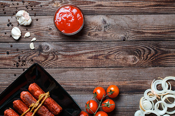 Image showing Sausage roasted on the grill.