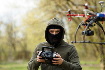 Image showing Man flying with the drone