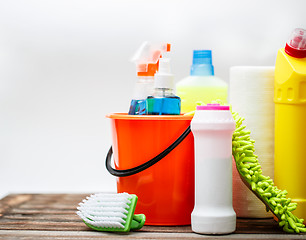 Image showing Bucket with cleaning items on light background