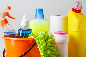 Image showing Bucket with cleaning items on light background