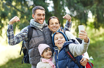 Image showing family taking selfie with smartphone in woods