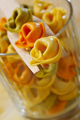 Image showing Dried raw tortellini (with meat, tomato and spinach filling)