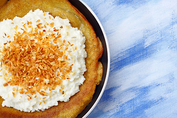 Image showing Pancake with cottage cheese and grated coconut topping