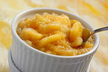 Image showing Ramekin filled by chopped and baked apple dessert