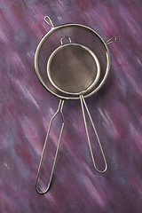 Image showing Pair of empty metal kitchen sieves