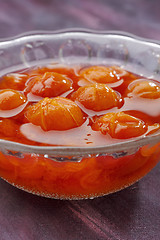 Image showing Glass bowl filled by compote made from red mirabelle plum