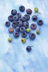 Image showing Blueberries over painted textile background