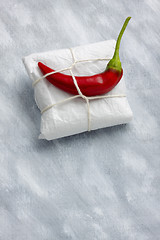 Image showing Still life with package and hot chili pepper