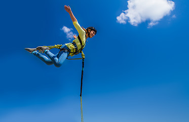 Image showing Girl jumping against the sky