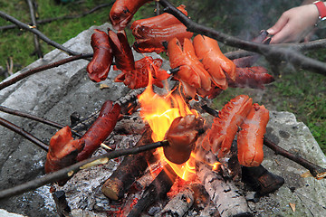 Image showing traditional czech sausages and the fire 